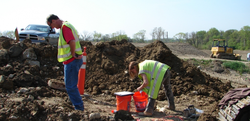 Image of two people working at the site.